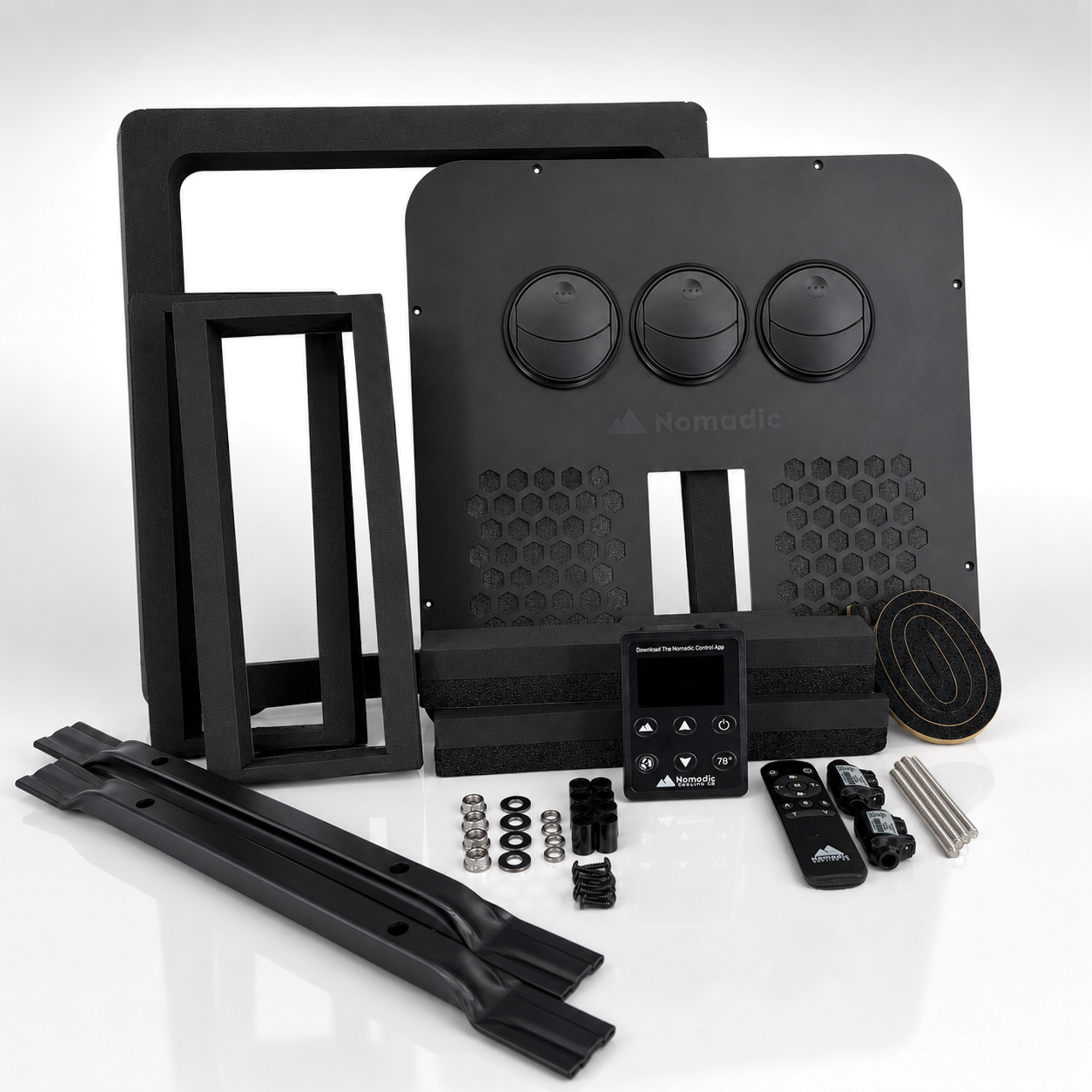 X2 Helix Gen II rooftop air conditioner installation parts kit showing flush metal faceplate, foam gasket, air ducts, crossbars, hardware, control panel, remote, and wiring connectors.