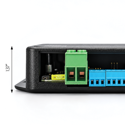 Close-up of the rear side of a black electronic device showing terminal blocks, with a green block and a blue block, plus a dimension marker indicating 137 inches.