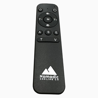 A black remote control with the Nomadic Cooling X Series brand logo on the front. It has labeled buttons for various remote functions such as power, mode, fan speed, temperature control, and a question mark button.